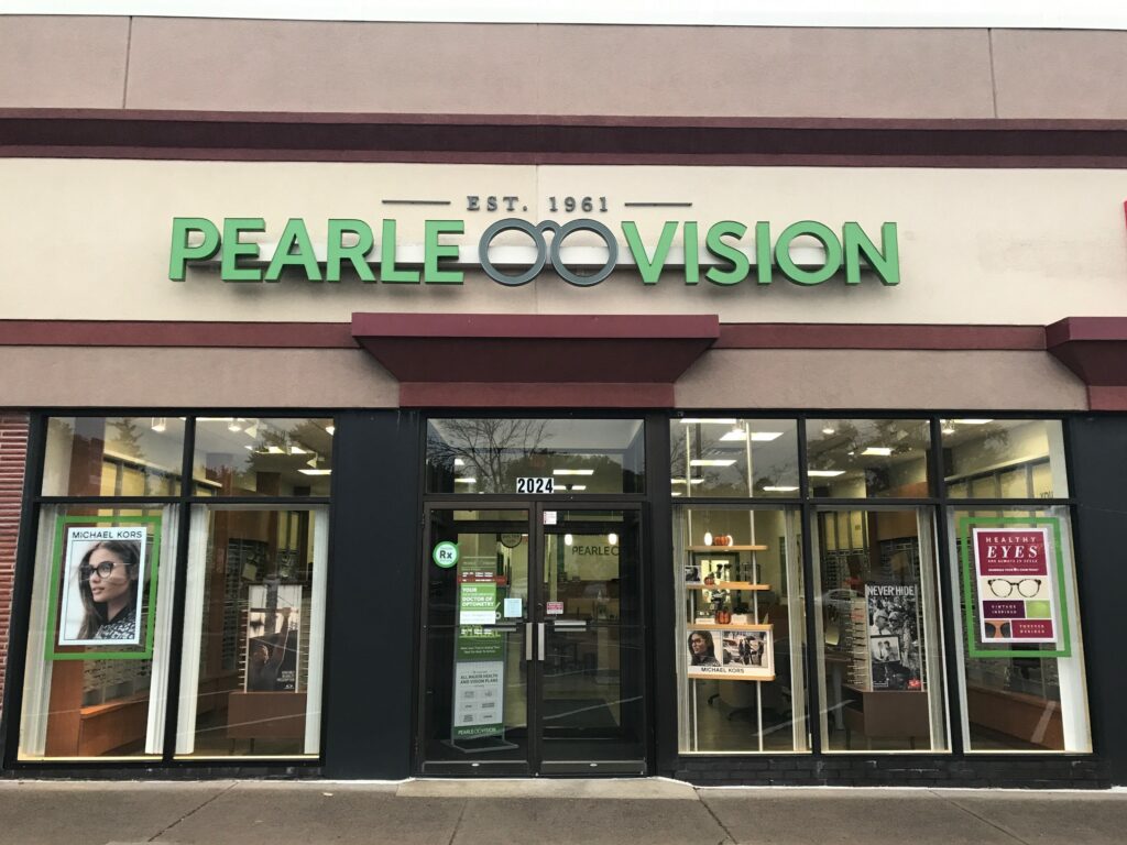 An exterior view of a Pearle Vision location in a shopping center