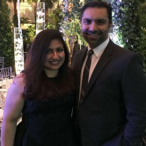 Pearle Vision Licensed Owners Amir and Ambreen Essani pose for a photo at a banquet.